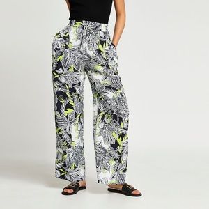 Black floral print pleated wide leg trousers